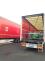 Kamion naložený paletami s humanitární pomocí pro Litvu.jpg