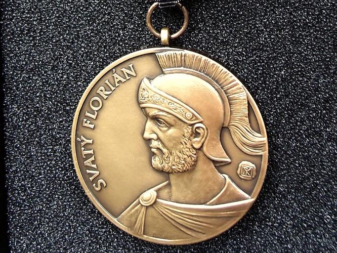 Florián na kominické medaili
